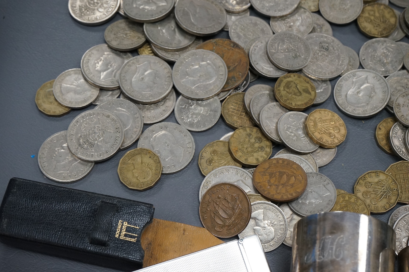 Sundry items comprising a cased Dunhill lighter, coins and napkin rings